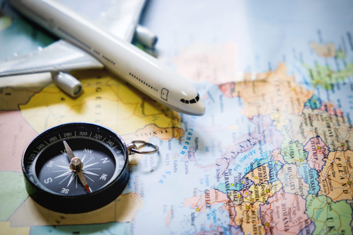 selective focus miniature tourist compass map with plastic toy airplane abstract background travel concept 700x467 - Untukmu Travelers, Simak 5 Tips Liburan Aman di Tengah Pandemi