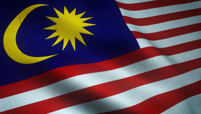 closeup shot waving flag malaysia with interesting textures 700x400 - Pekerja Migran di Malaysia Harus Paham Hal-hal Berikut Ini